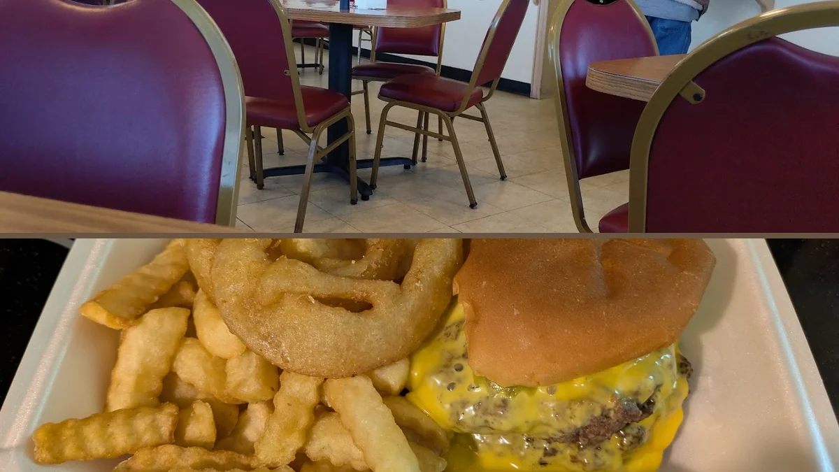 Drive-in restaurant exterior with parking nearby.