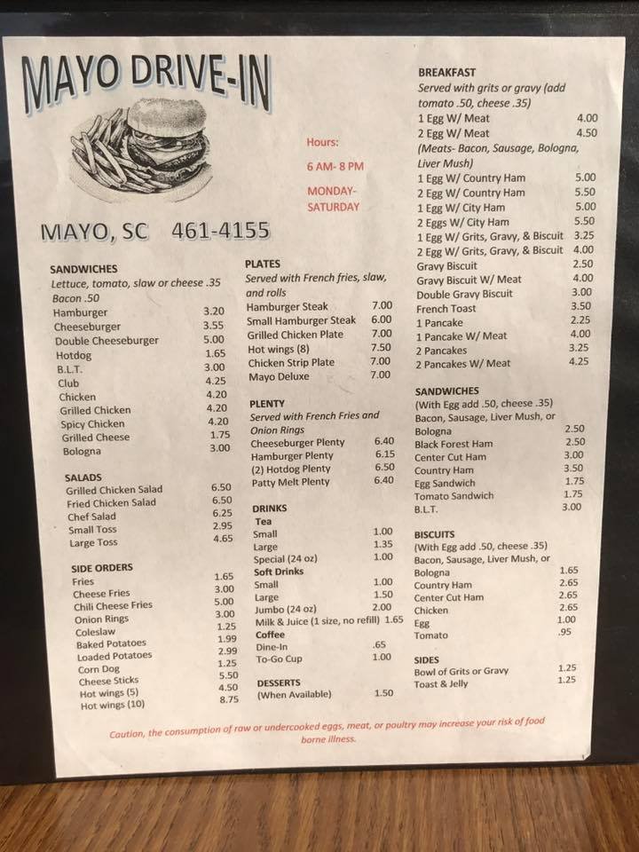 Printed menu with burgers, salads, and sides.